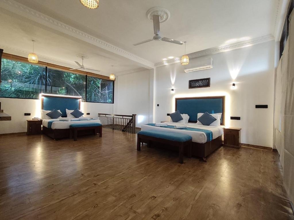 Spacious guest room with multiple beds