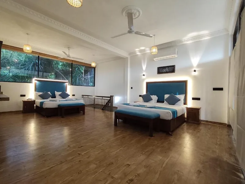 Spacious guest room with multiple beds
